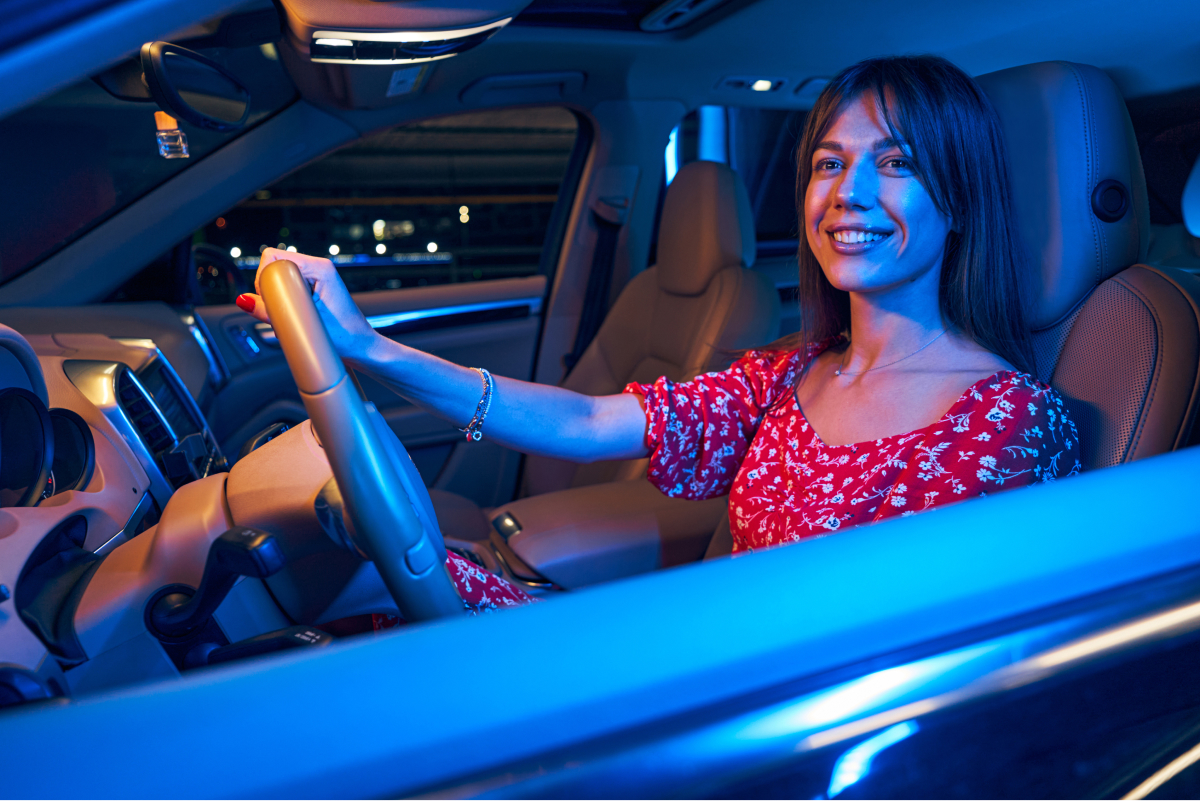 cheerful young woman driving car at night 2022 01 18 23 45 08 utc 3mc